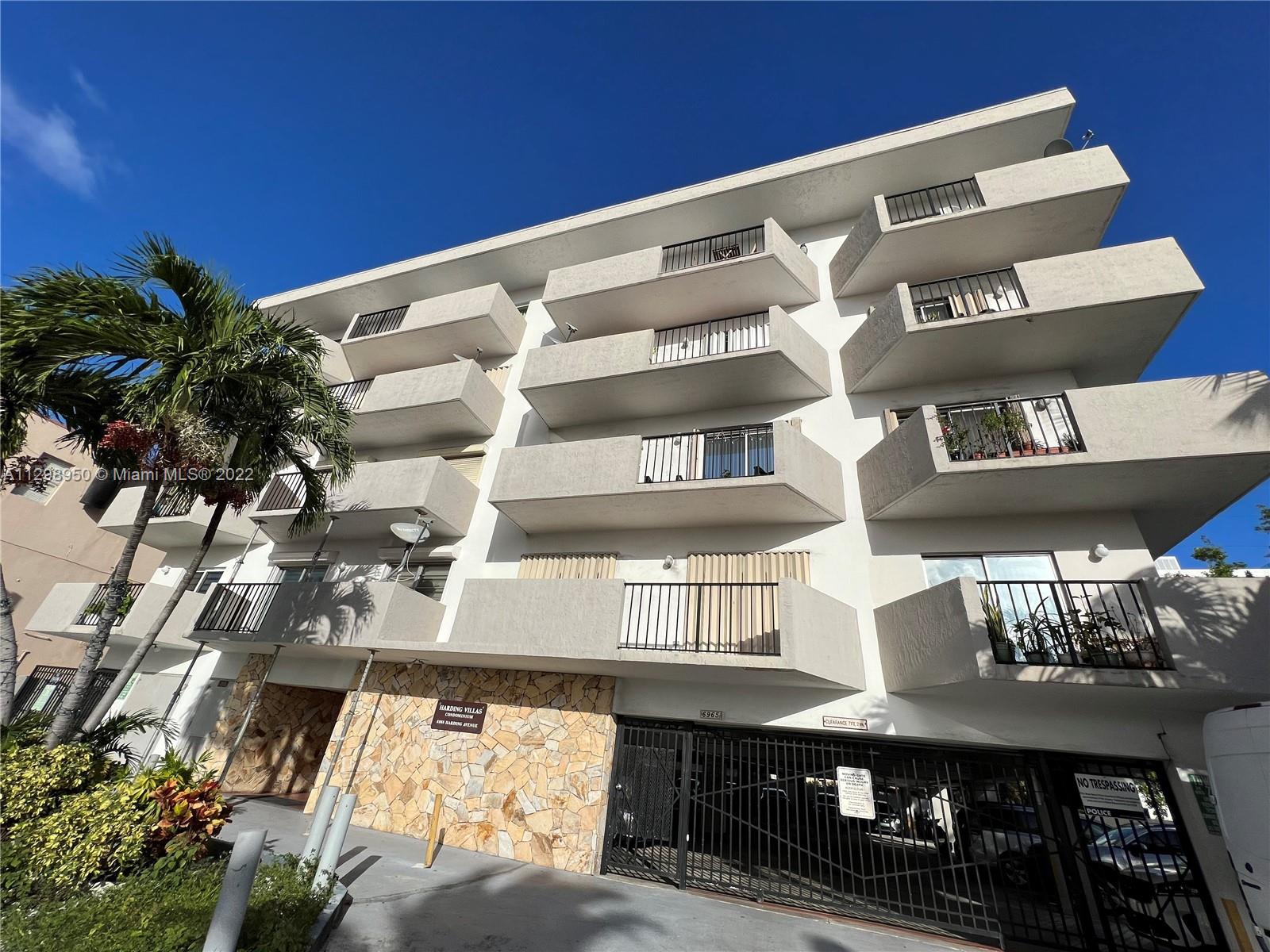 6965 Harding Avenue, Unit 406 Miami Beach, FL 33141 - Photo 1 of 10 a view of entryway and hall with wooden floor