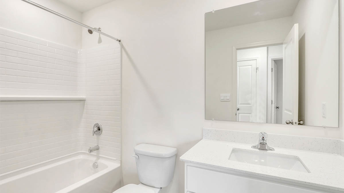 6510 Linden Trail, Unit B Wonder Lake, IL 60097 - Photo 13 of 17 a bathroom with a sink a toilet and shower