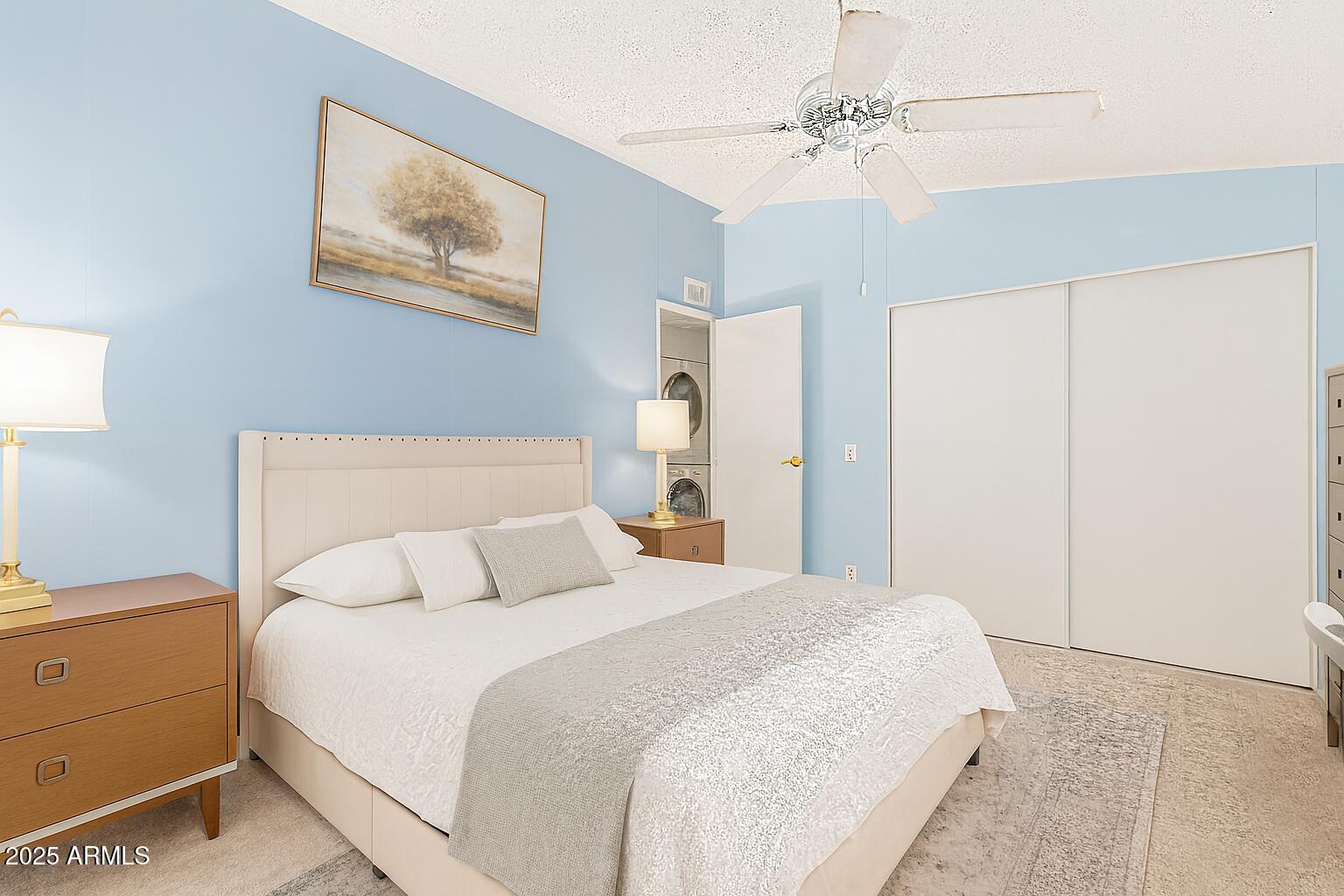 1102 South 114th Street, Unit 72 Mesa, AZ 85208 - Photo 4 of 20 a bedroom with a bed and a chandelier