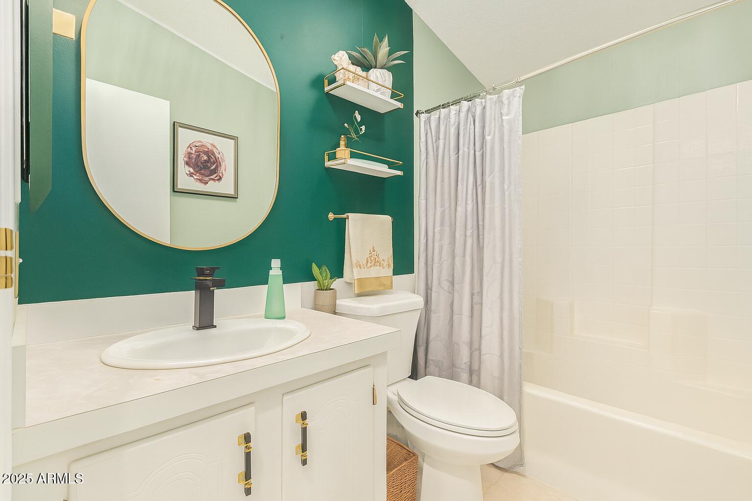 1102 South 114th Street, Unit 72 Mesa, AZ 85208 - Photo 9 of 20 a bathroom with a toilet sink and mirror