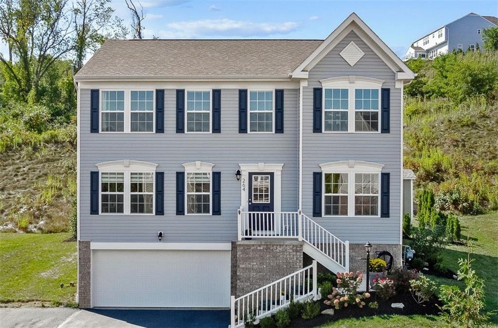 264 Lily Ridge Drive Canonsburg, PA 15317 - Photo 1 of 50 a front view of a house with garden
