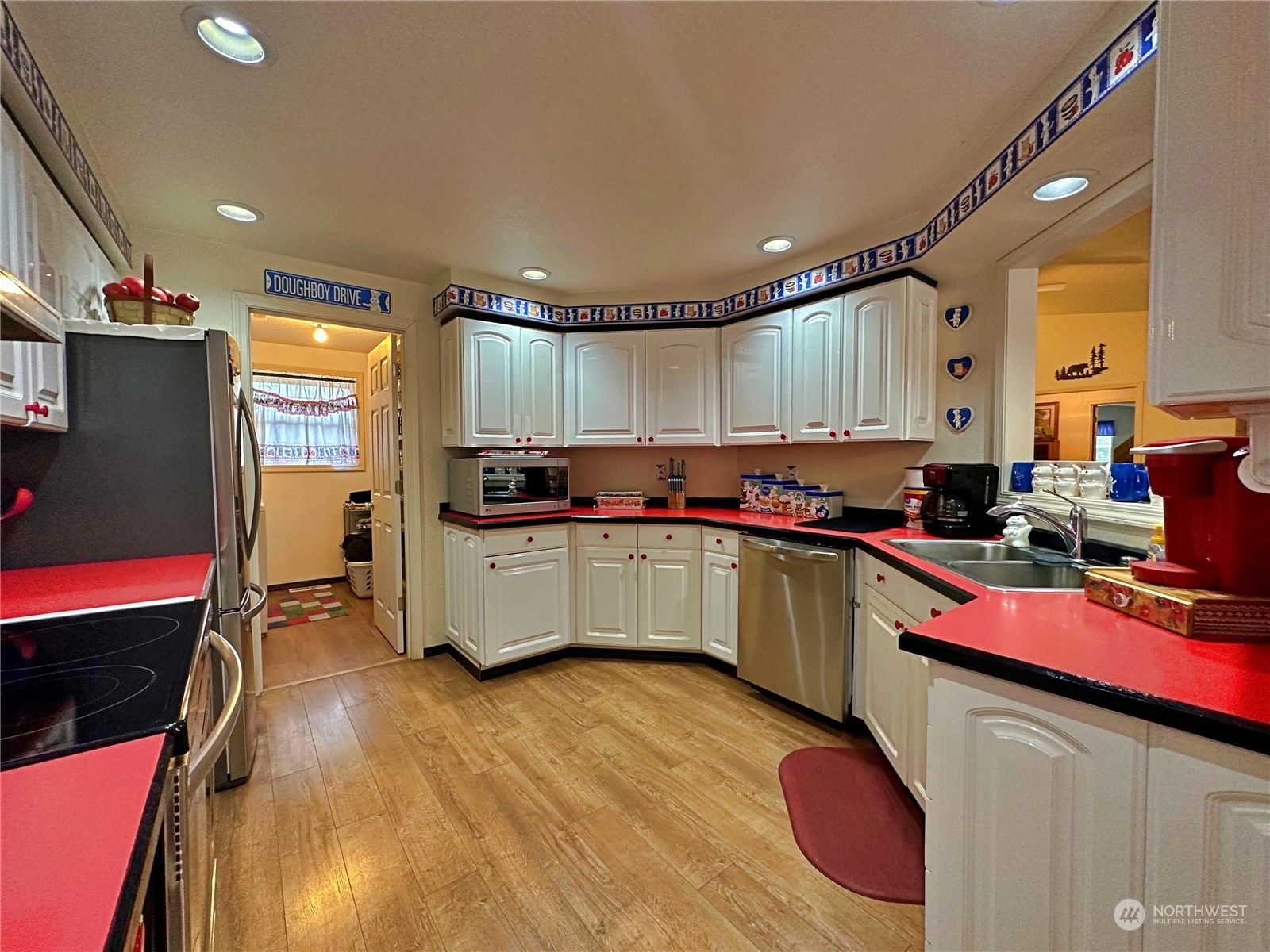 104 Compton Road Morton, WA 98356 - Photo 17 of 35 a kitchen with a refrigerator and a stove top oven