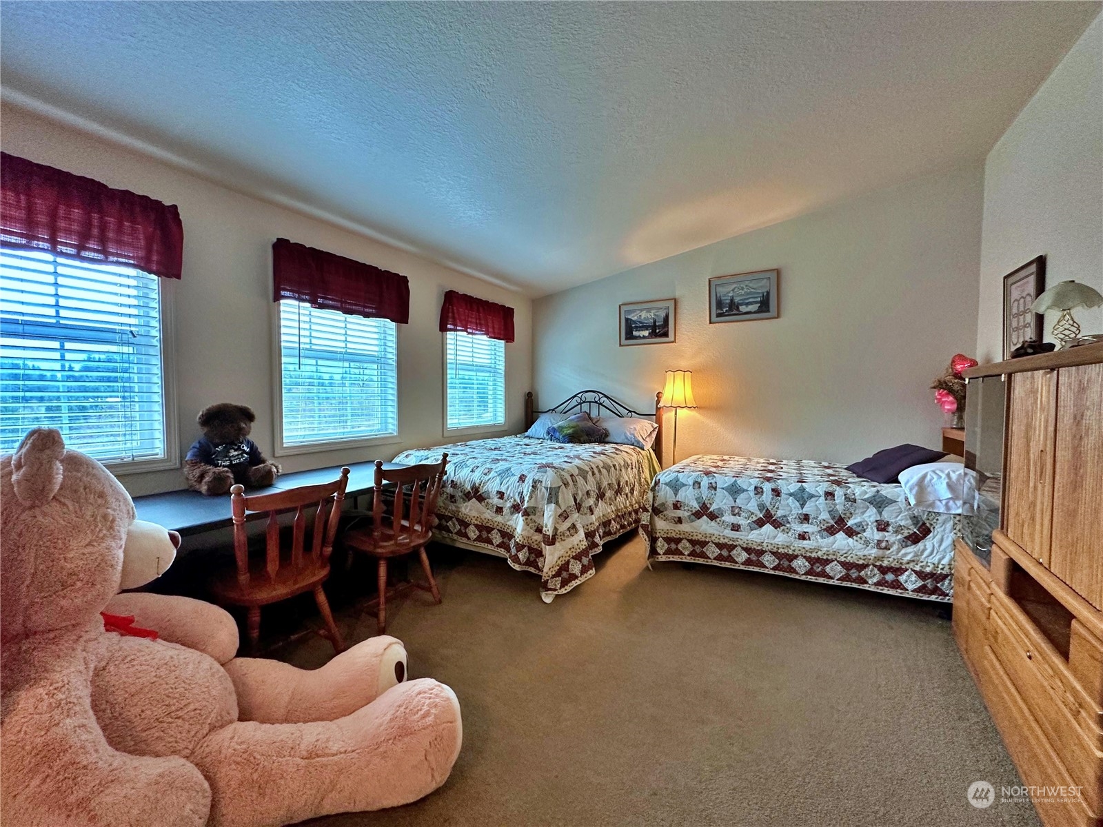 104 Compton Road Morton, WA 98356 - Photo 21 of 35 a bedroom with furniture and a large window