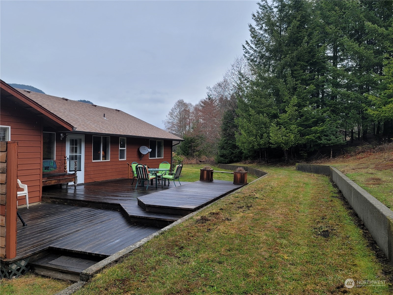 104 Compton Road Morton, WA 98356 - Photo 10 of 35 a view of house with backyard and outdoor seating
