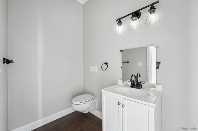 a bathroom with a sink toilet and vanity