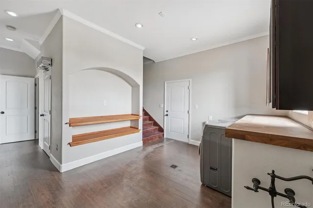 a view of entryway and hall with wooden floor