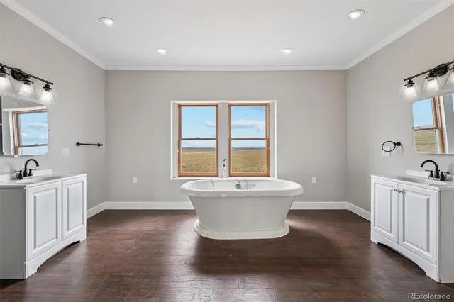 a spacious bathroom with a bathtub and sink