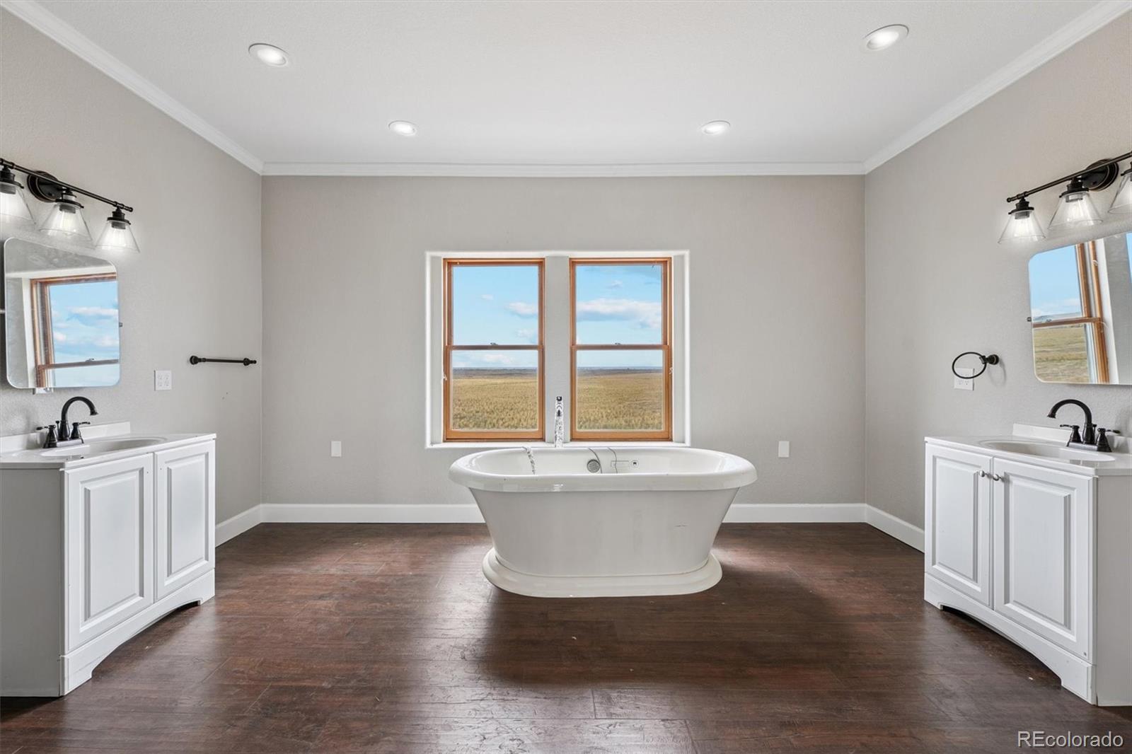 2105 Timberlake Road Byers, CO 80103 - Photo 23 of 48 a spacious bathroom with a bathtub and sink