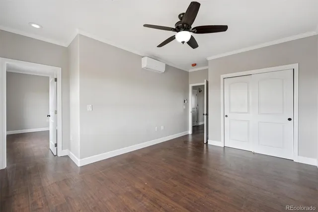 a view of an empty room and wooden floor