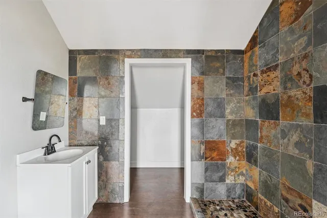 a bathroom with a sink and a mirror