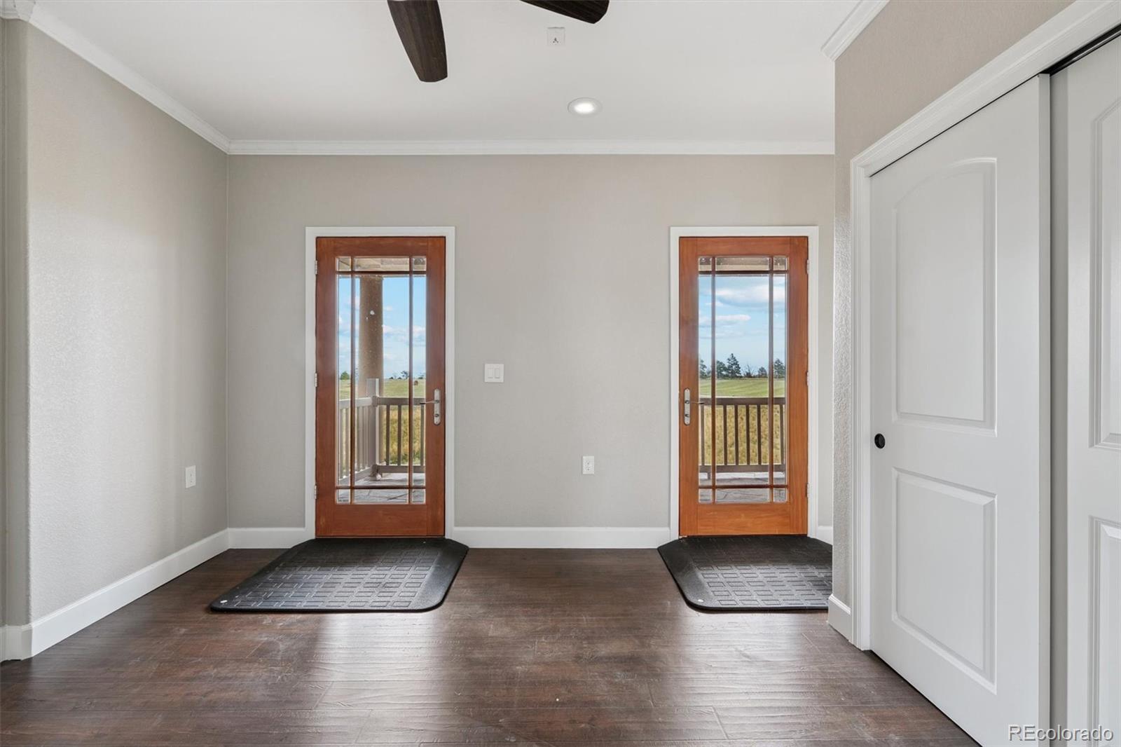2105 Timberlake Road Byers, CO 80103 - Photo 32 of 48 an entryway at livingroom with furniture and windows