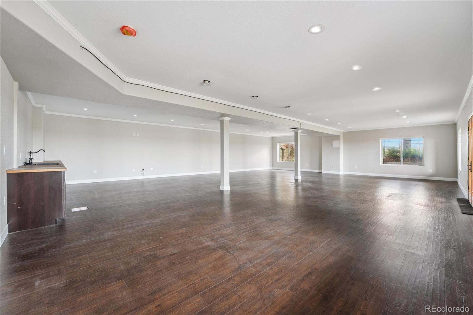 2105 Timberlake Road Byers, CO 80103 - Photo 33 of 48 a view of empty room with wooden floor