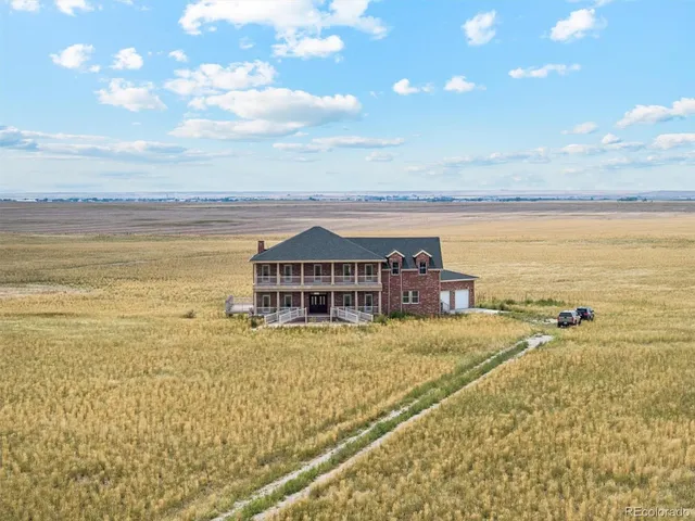 an aerial view of a house with a ocean view