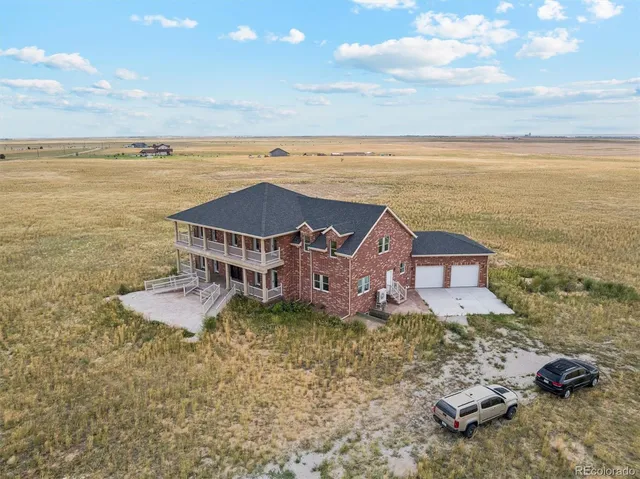 an aerial view of a house with a ocean view