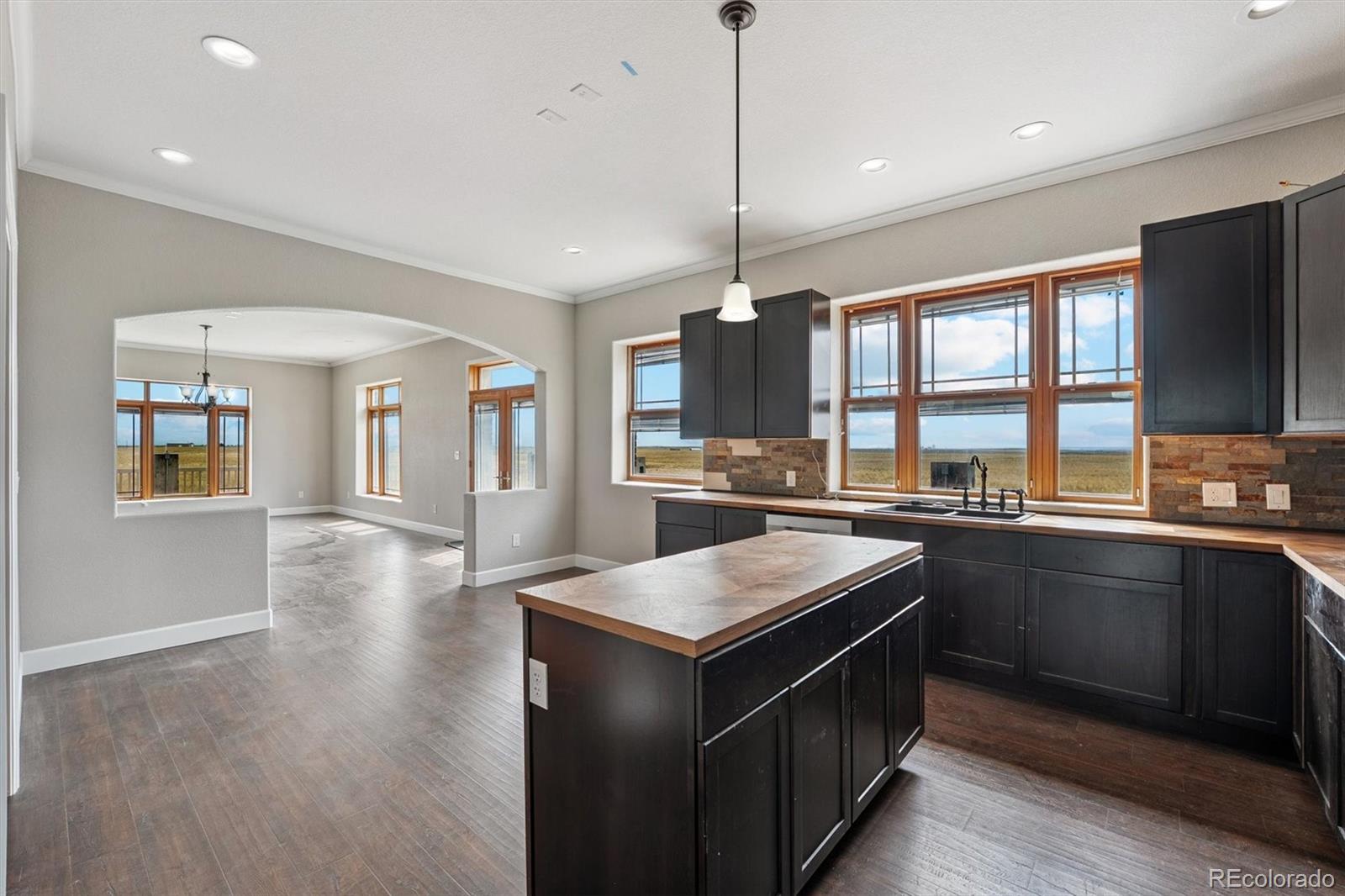 2105 Timberlake Road Byers, CO 80103 - Photo 5 of 48 a kitchen with stainless steel appliances granite countertop a stove and a sink