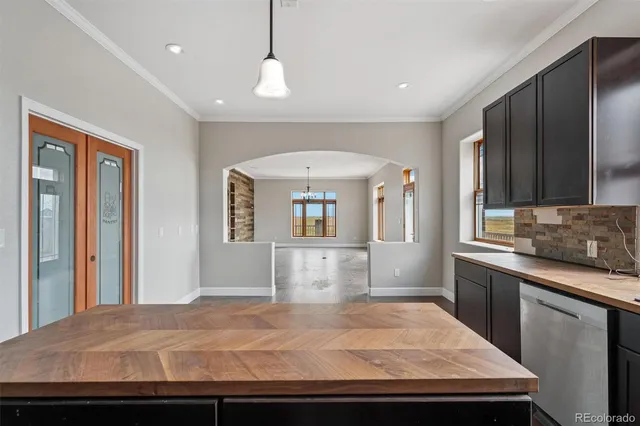 a bedroom with a large bed and a dresser