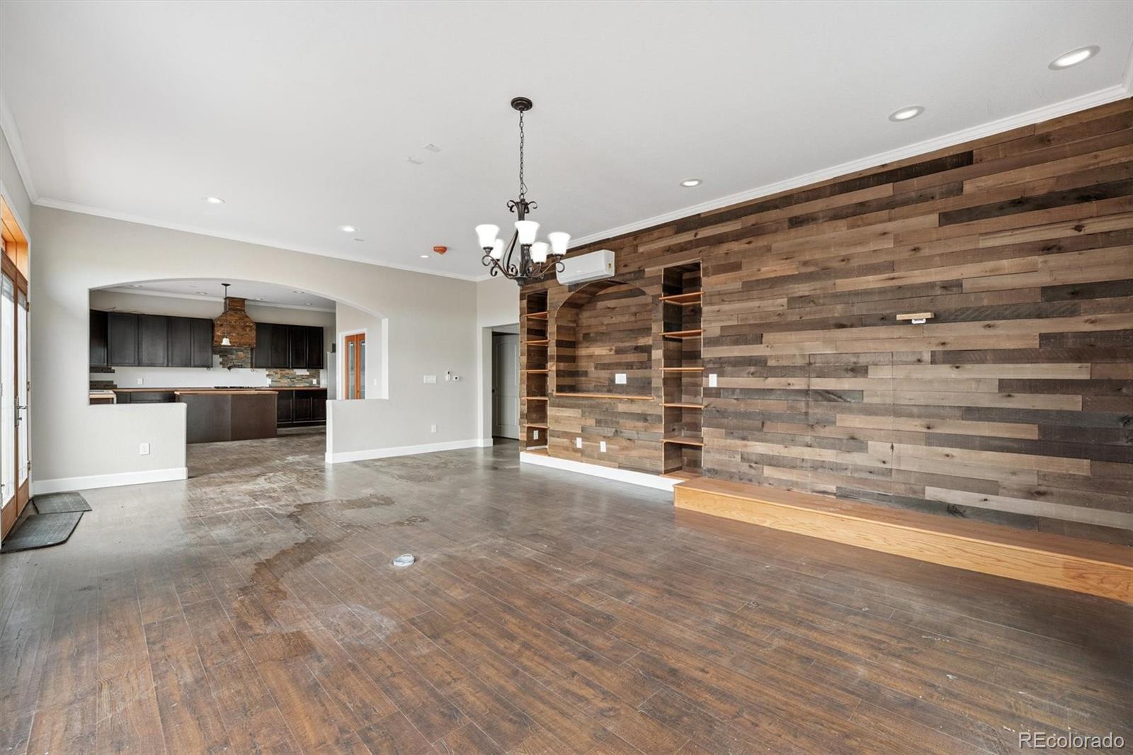 2105 Timberlake Road Byers, CO 80103 - Photo 10 of 48 a view of a livingroom with a furniture wooden floor and a kitchen