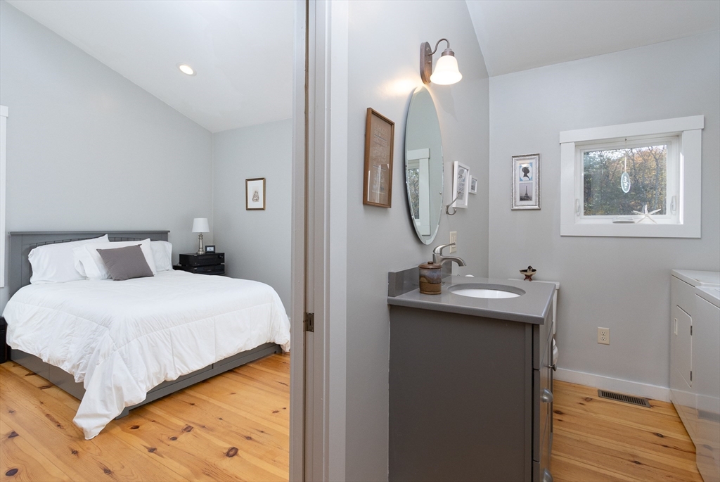 216 Padre Road New Braintree, MA 01531 - Photo 17 of 29 a bedroom with a bed and a mirror