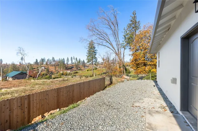 a view of a backyard of the house