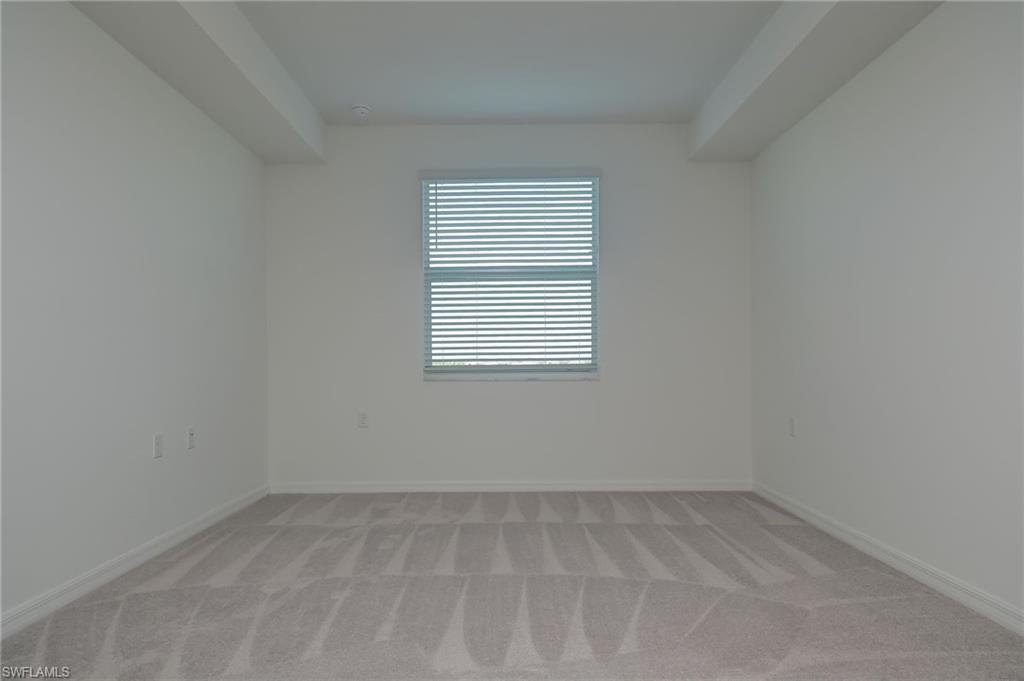 5835 Double Eagle Circle, Unit 4724 Immokalee, FL 34142 - Photo 11 of 25 an empty room with a window