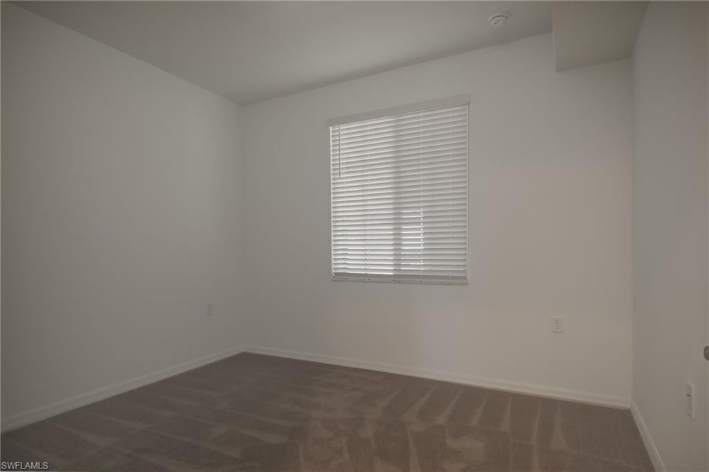 5835 Double Eagle Circle, Unit 4724 Immokalee, FL 34142 - Photo 15 of 25 an empty room with a window