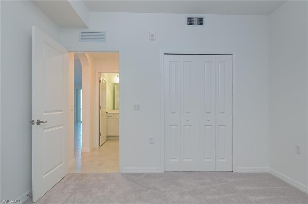 5835 Double Eagle Circle, Unit 4724 Immokalee, FL 34142 - Photo 16 of 25 a view of an empty room with a bathroom