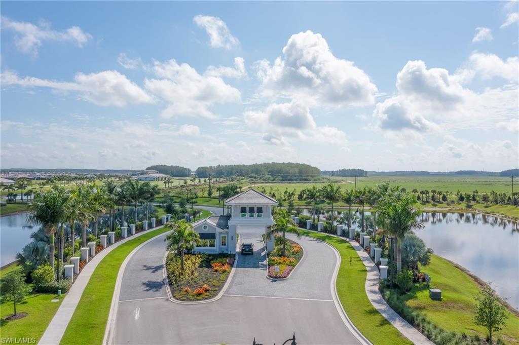 5835 Double Eagle Circle, Unit 4724 Immokalee, FL 34142 - Photo 24 of 25 a view of a swimming pool with a garden