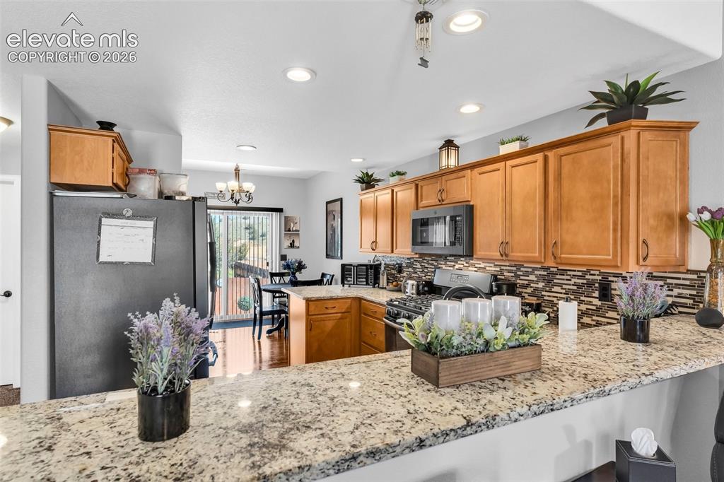 415 Empire Road Canon City, CO 81212 - Photo 13 of 40 a kitchen with sink and refrigerator