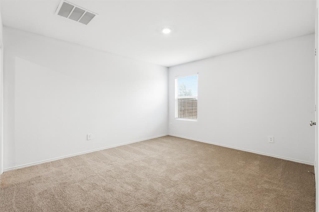 2604 Spring Time Drive Ennis, TX 75119 - Photo 15 of 21 an empty room with a window