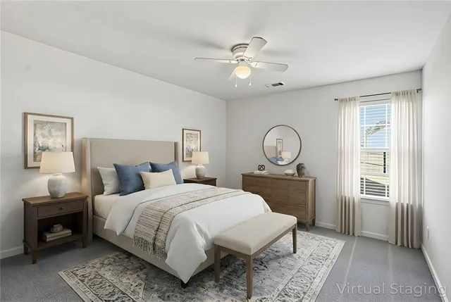 a bedroom with a bed a table and chair