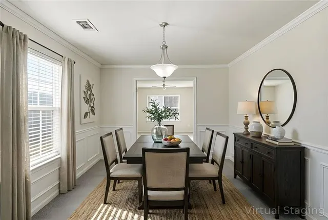a dining room with furniture a window and a chandelier