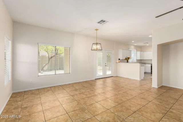 a view of a kitchen with a sink and a refrigerator in it