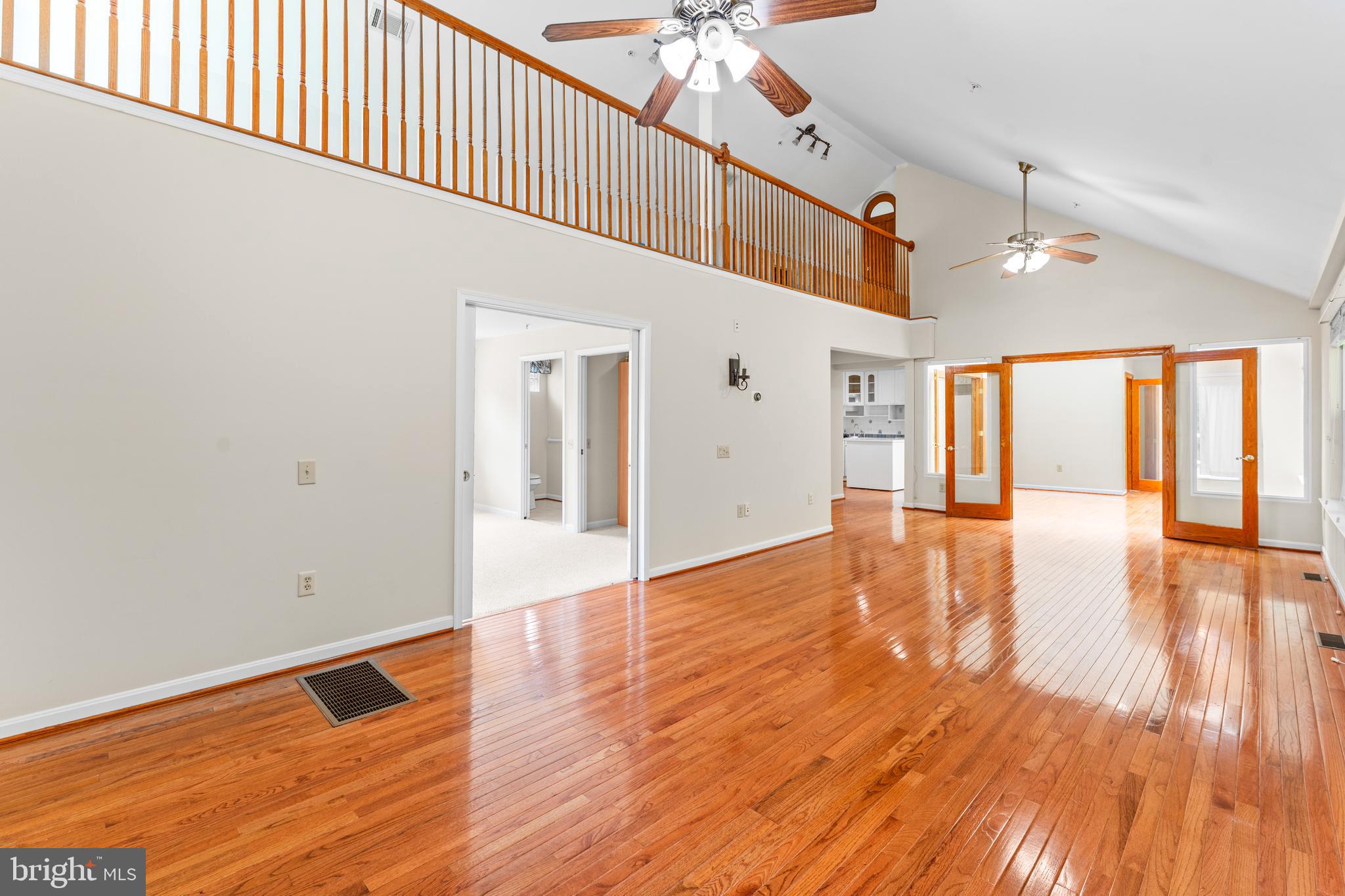 11709 Thrift Road Clinton, MD 20735 - Photo 14 of 71 a view of an empty room with wooden floor