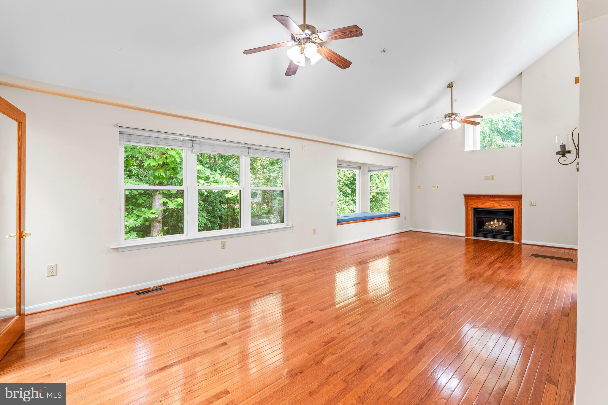 11709 Thrift Road Clinton, MD 20735 - Photo 15 of 71 a view of empty room with wooden floor and fan