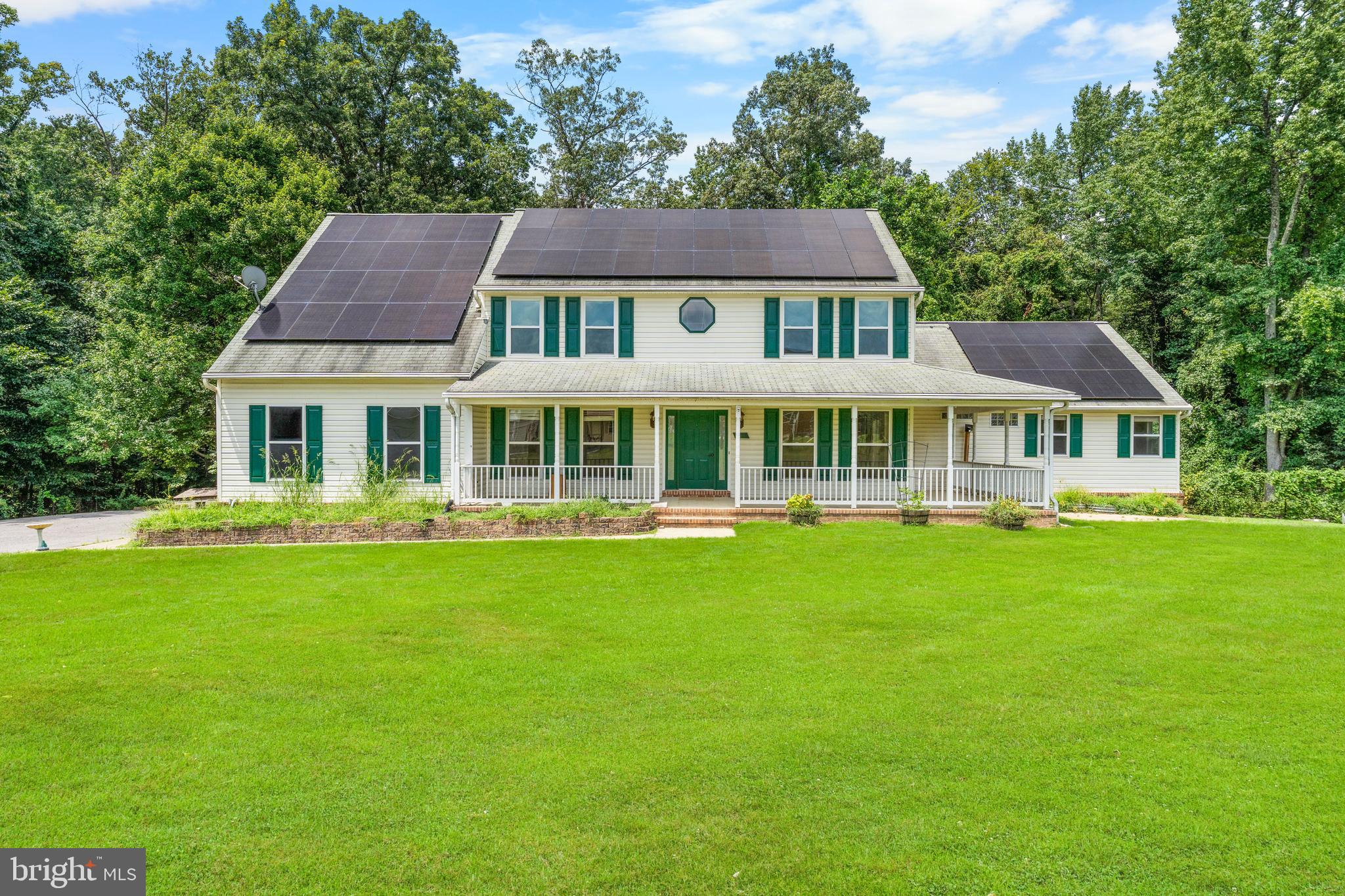 11709 Thrift Road Clinton, MD 20735 - Photo 2 of 71 a front view of a house with a garden