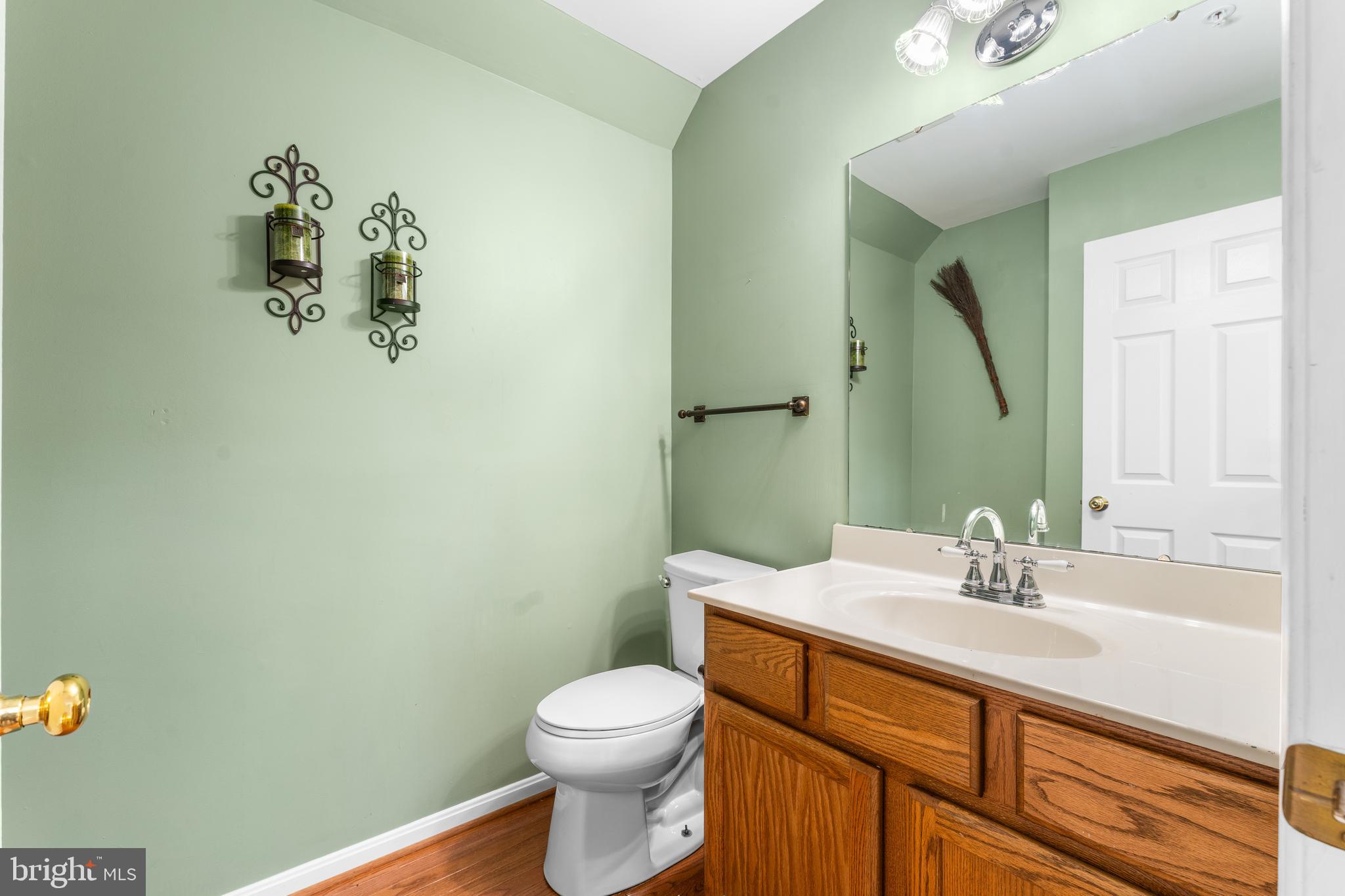 11709 Thrift Road Clinton, MD 20735 - Photo 22 of 71 a bathroom with a sink mirror and toilet
