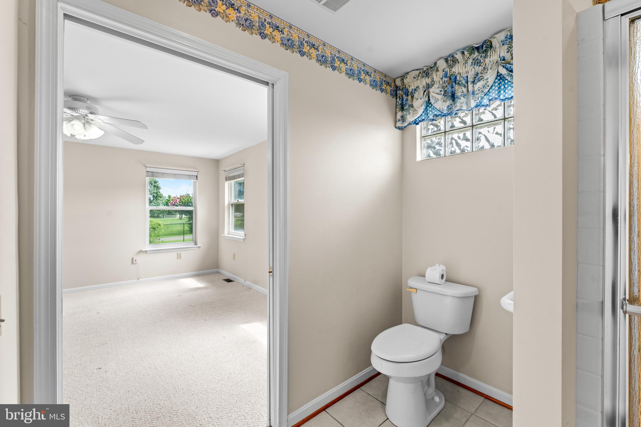 11709 Thrift Road Clinton, MD 20735 - Photo 31 of 71 a bathroom with a toilet sink and vanity
