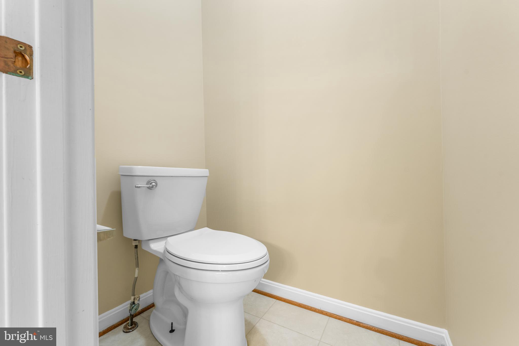 11709 Thrift Road Clinton, MD 20735 - Photo 41 of 71 a white toilet sitting next to a white wall