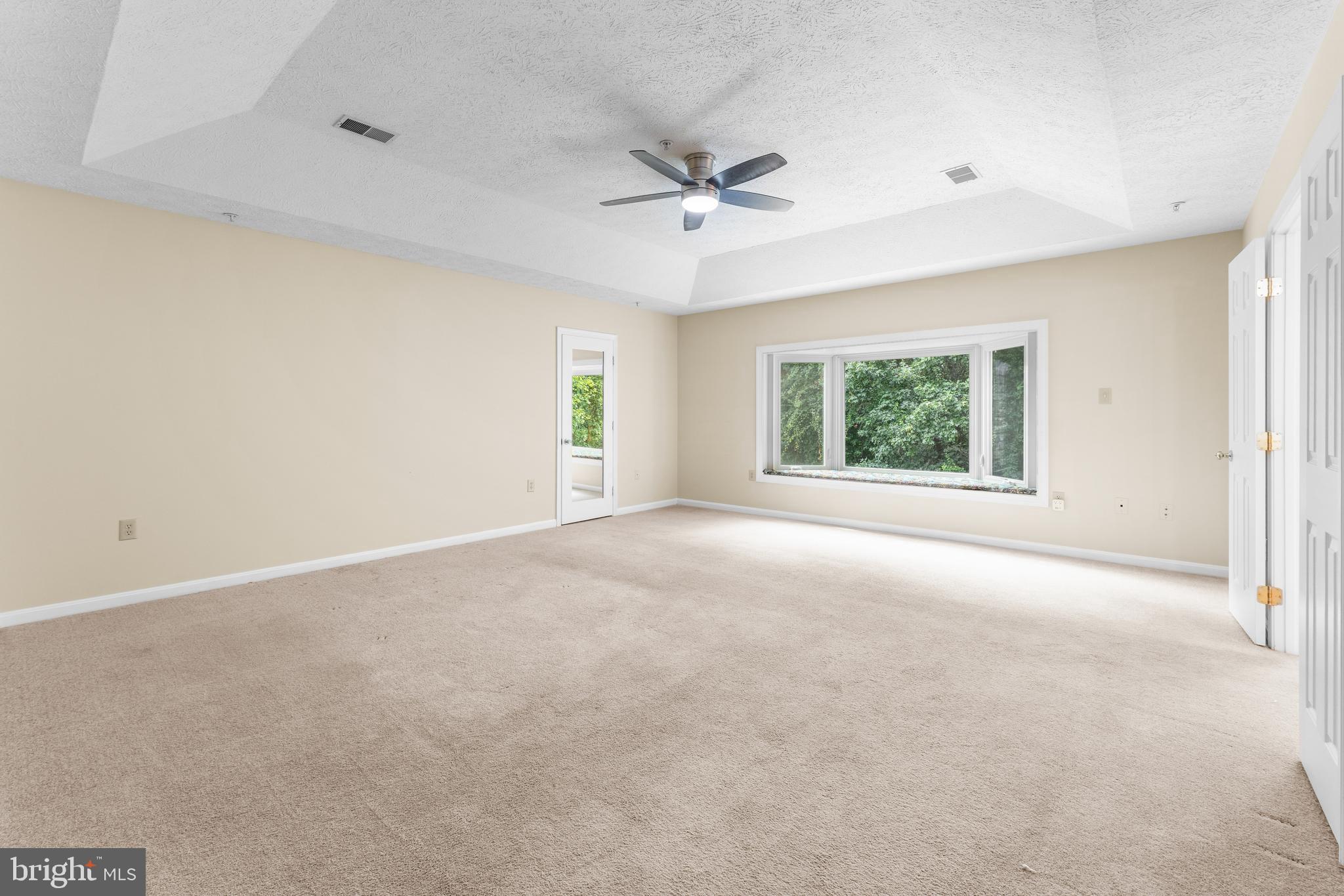 11709 Thrift Road Clinton, MD 20735 - Photo 42 of 71 an empty room with windows and ceiling fan