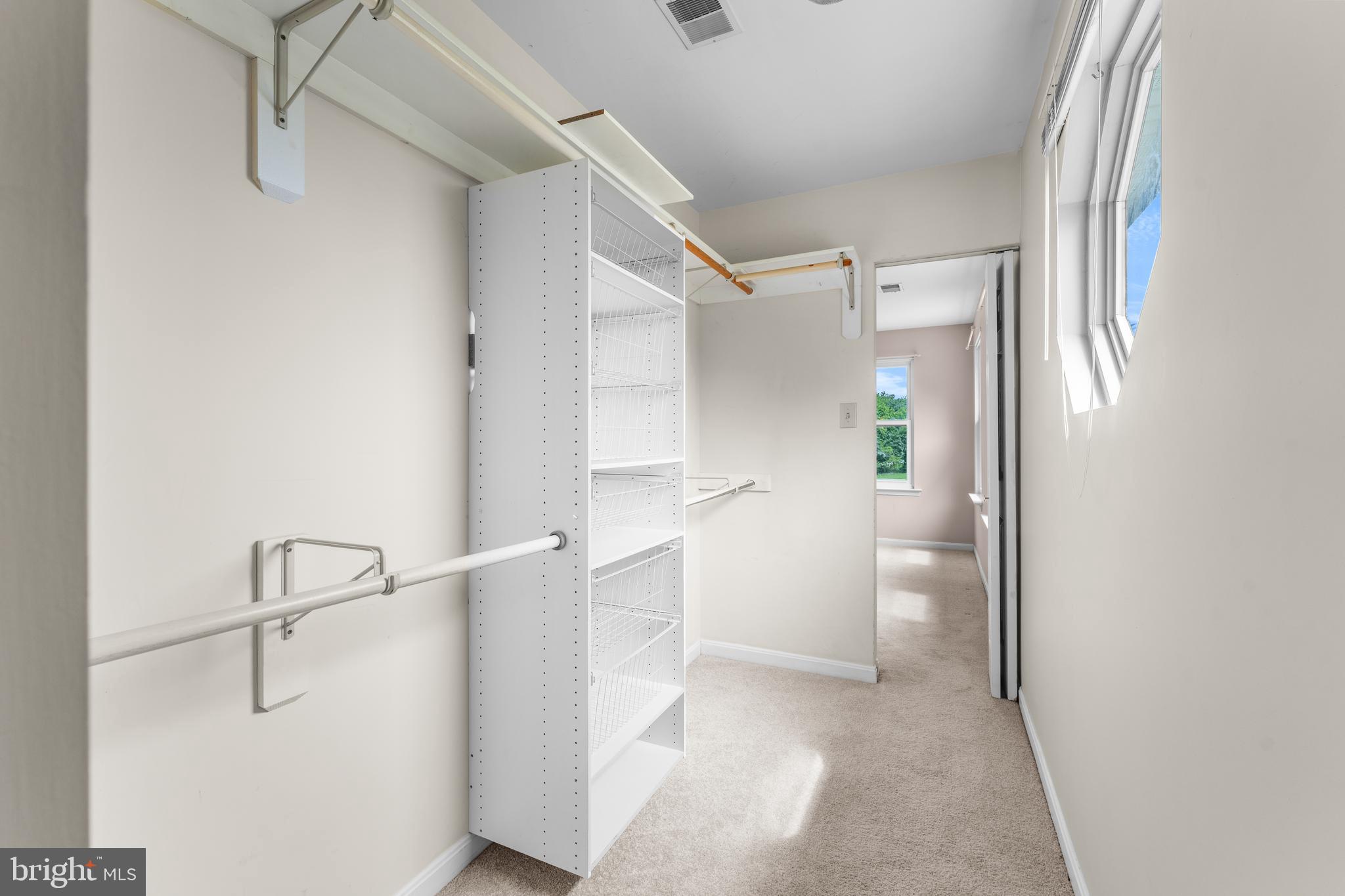 11709 Thrift Road Clinton, MD 20735 - Photo 52 of 71 a view of walk in closet with empty racks