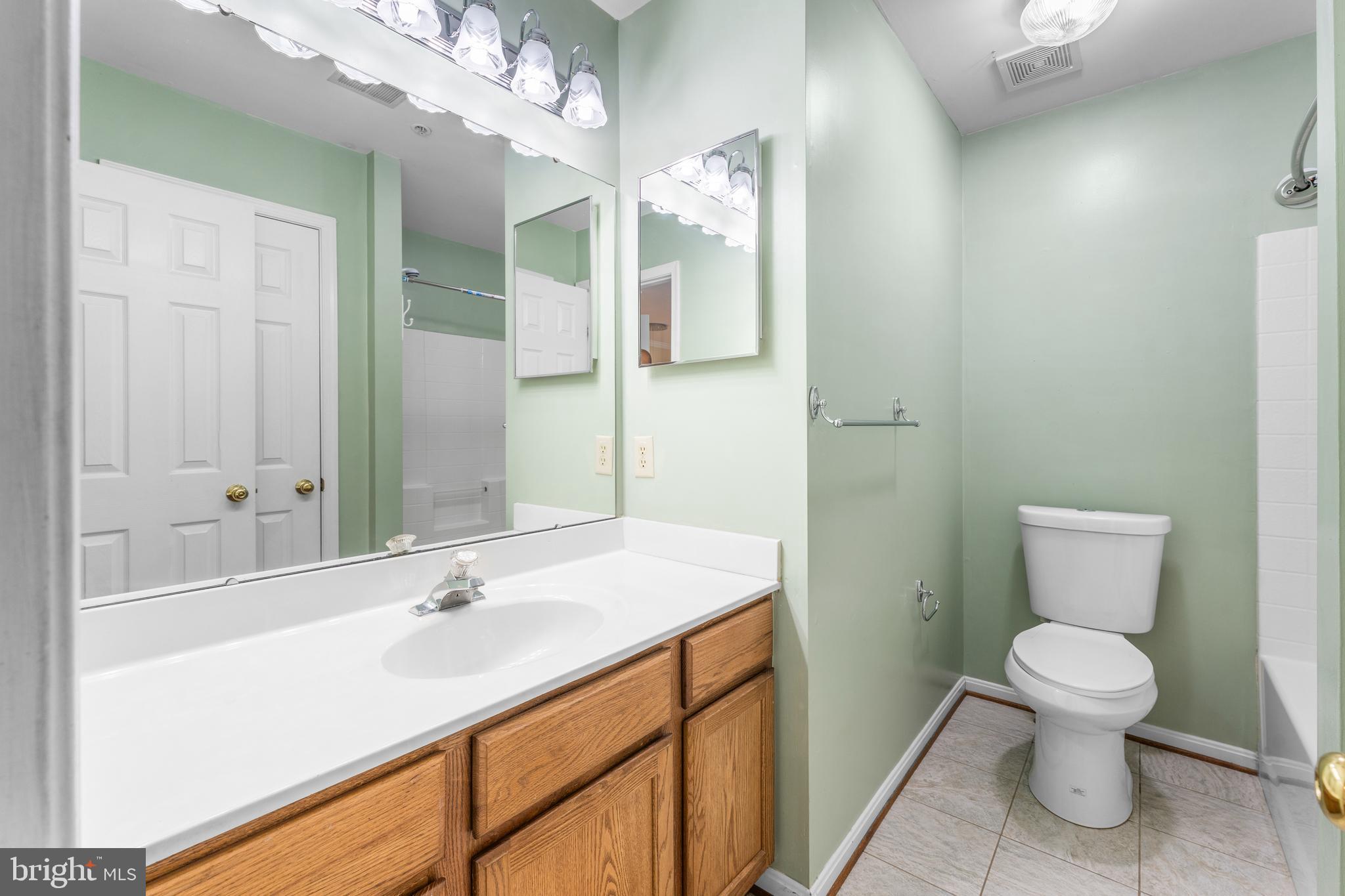 11709 Thrift Road Clinton, MD 20735 - Photo 55 of 71 a bathroom with a sink a toilet and shower