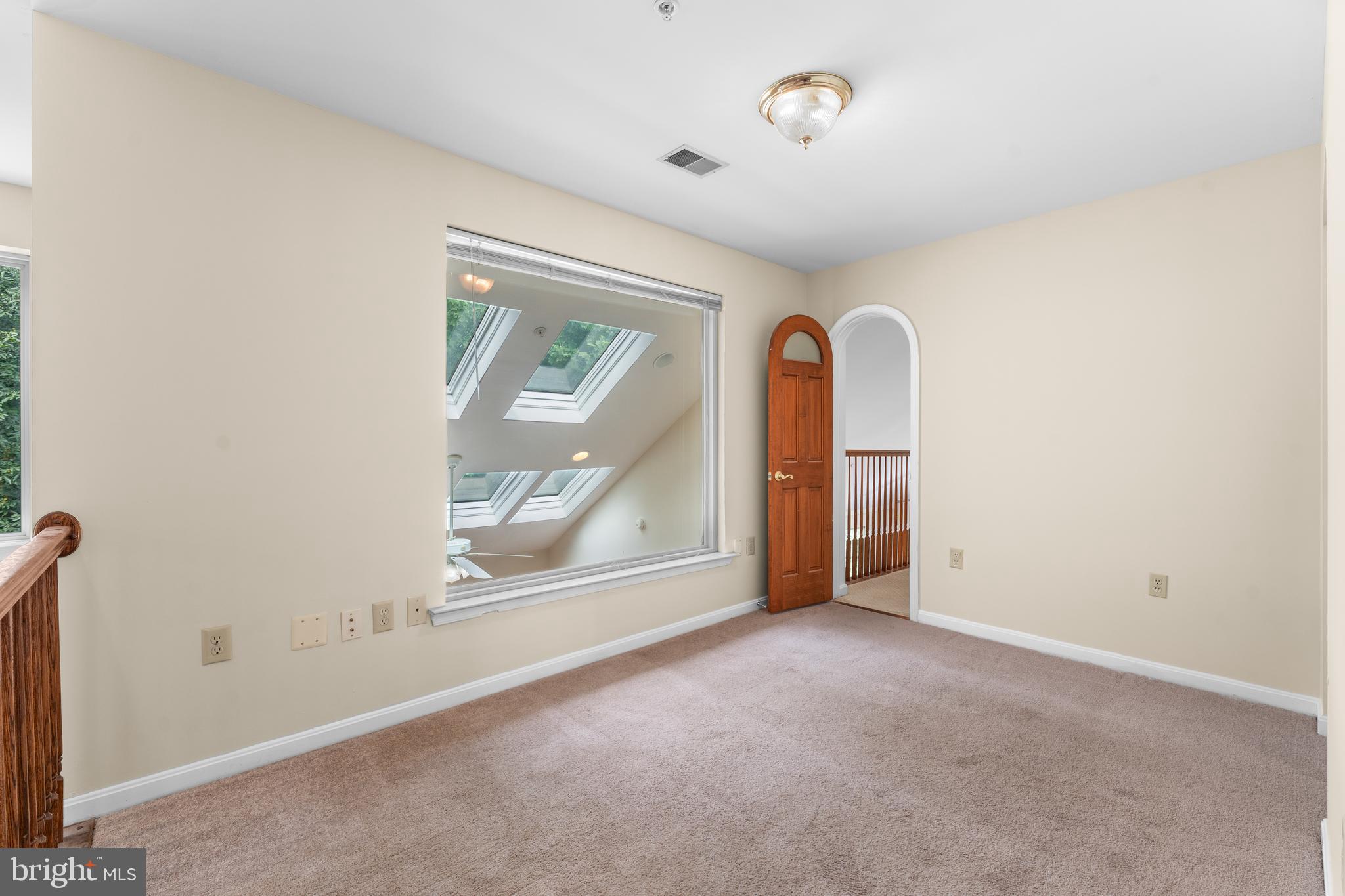 11709 Thrift Road Clinton, MD 20735 - Photo 57 of 71 an empty room with windows and mirror