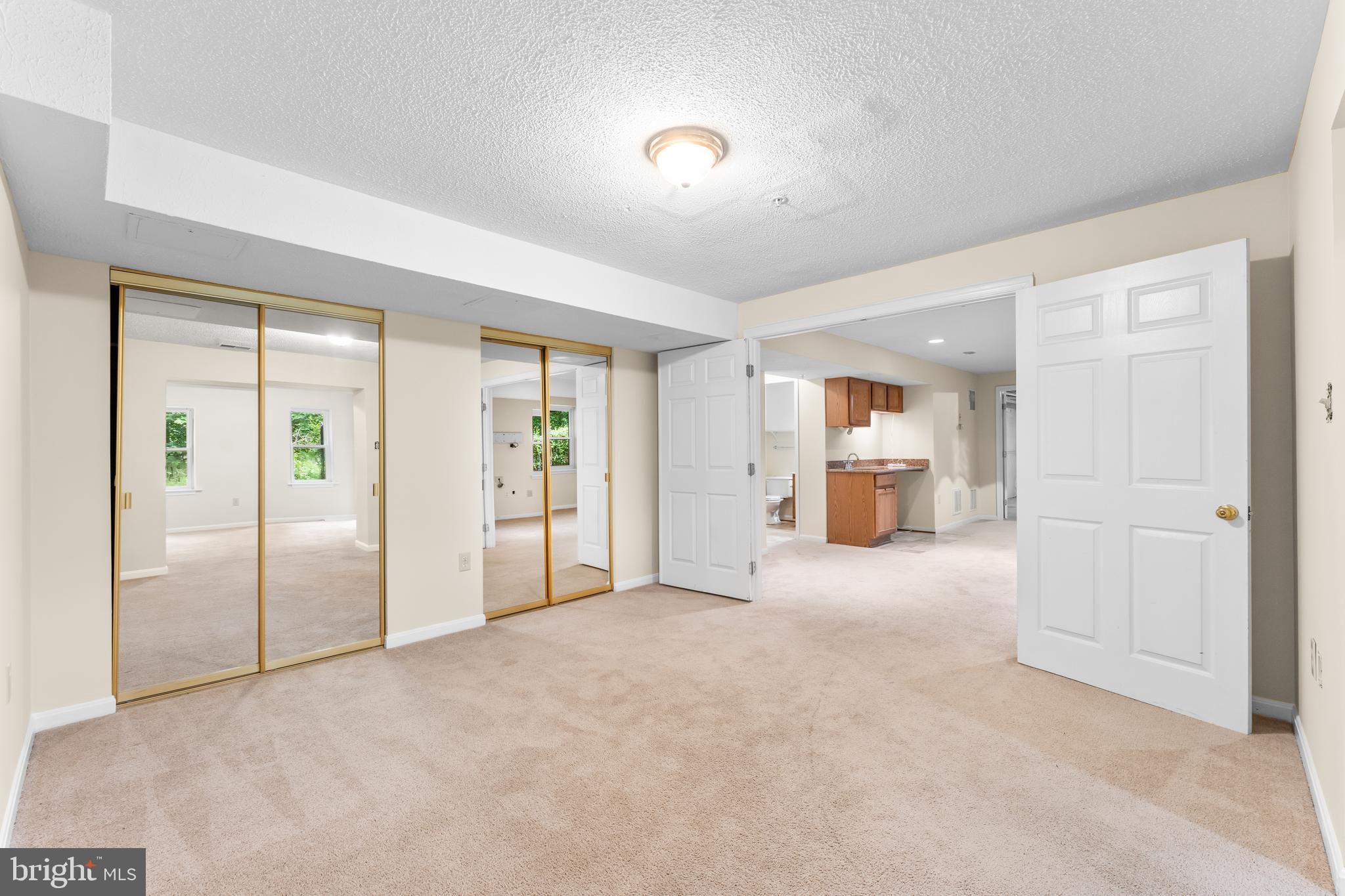 11709 Thrift Road Clinton, MD 20735 - Photo 62 of 71 an empty room with closet and windows