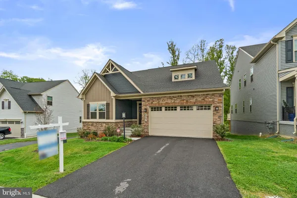 a view of house with yard