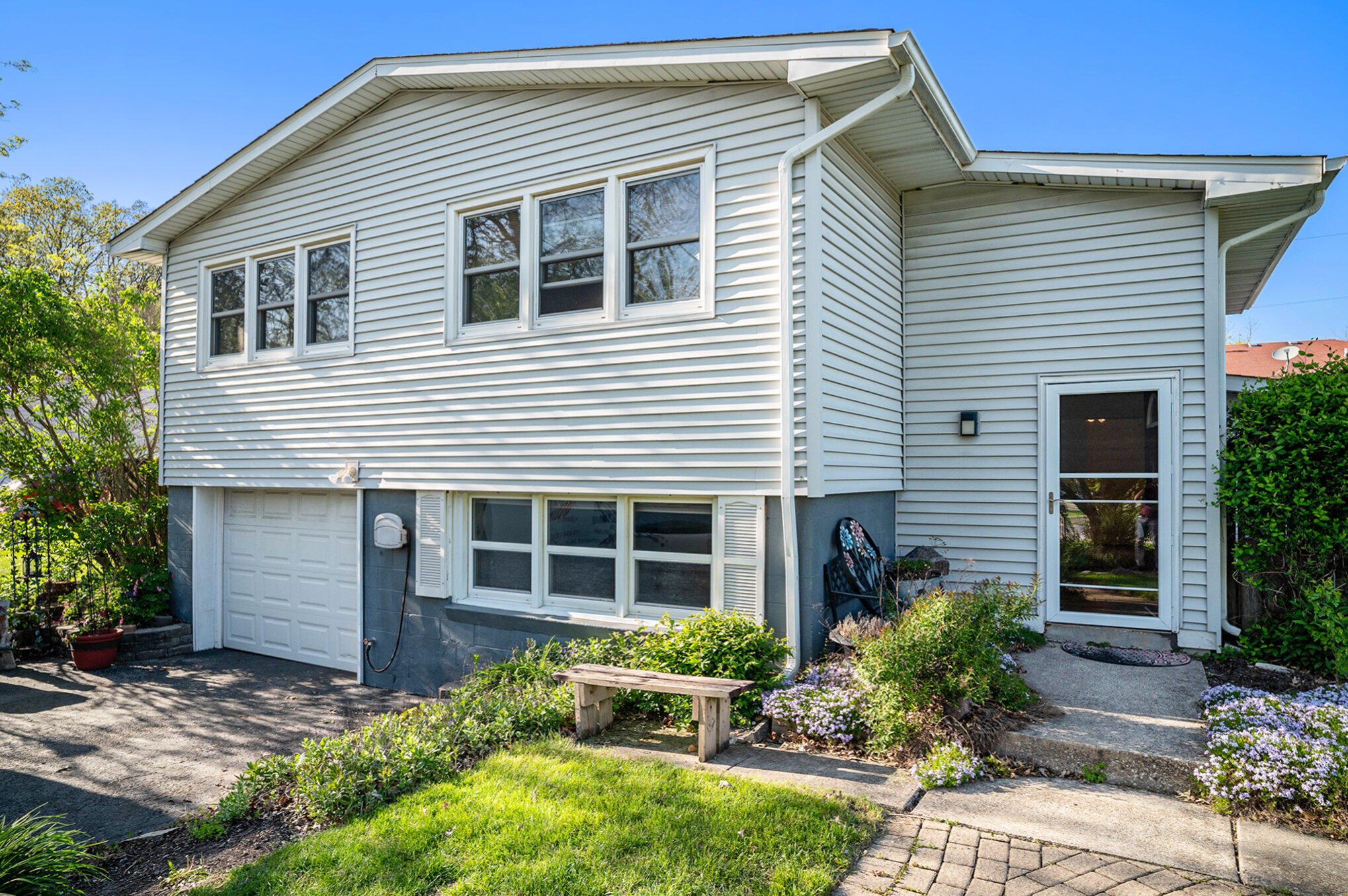 a front view of a house with garden
