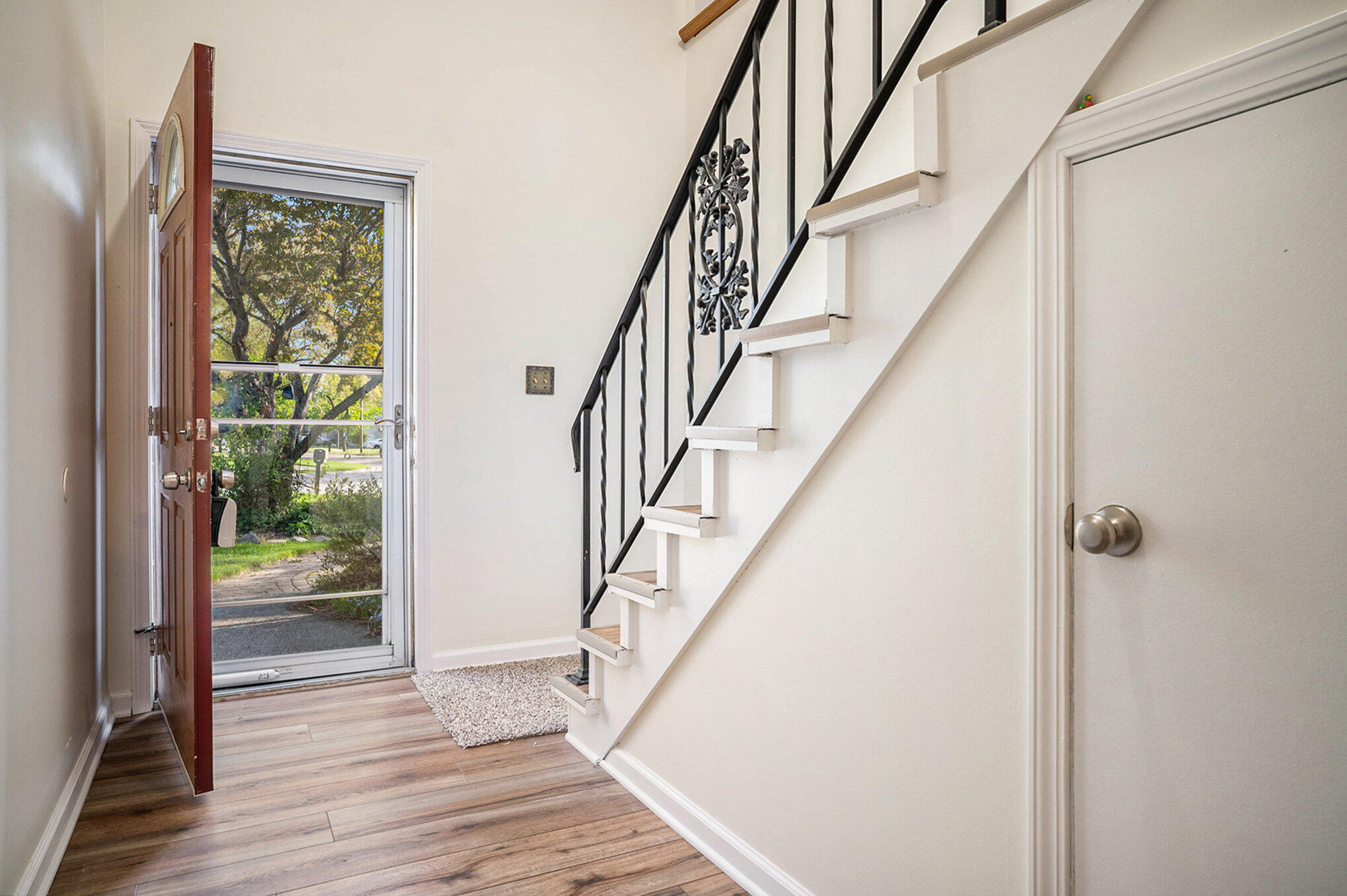938 Walnut Lane Crown Point, IN 46307 - Photo 2 of 17 a view of staircase with wooden floor and stairs