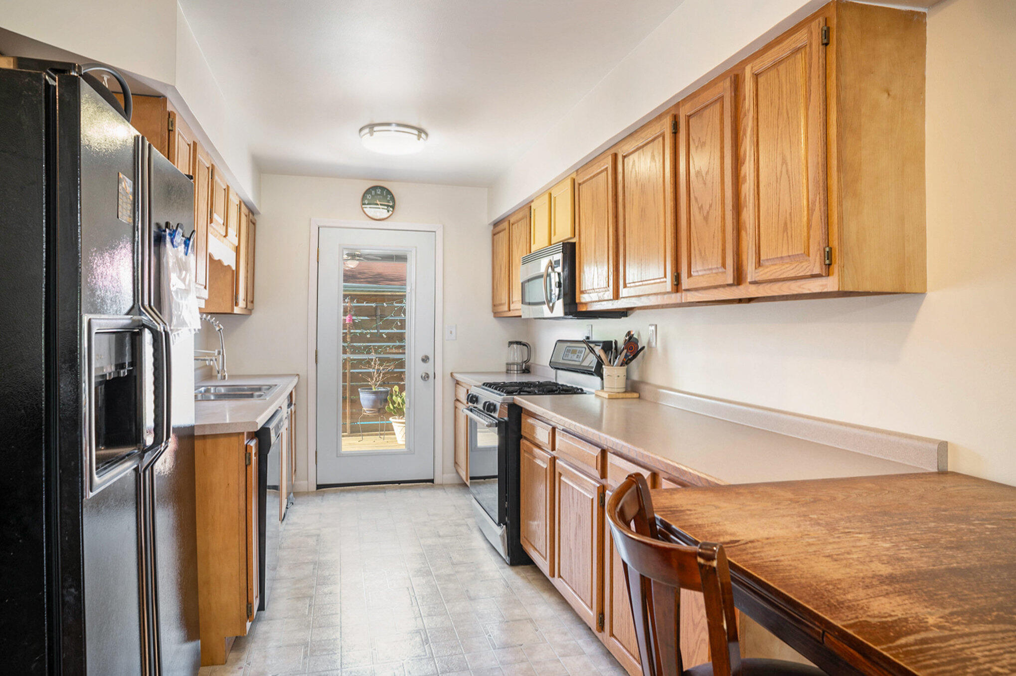938 Walnut Lane Crown Point, IN 46307 - Photo 4 of 17 a kitchen with stainless steel appliances granite countertop a refrigerator a stove and a sink