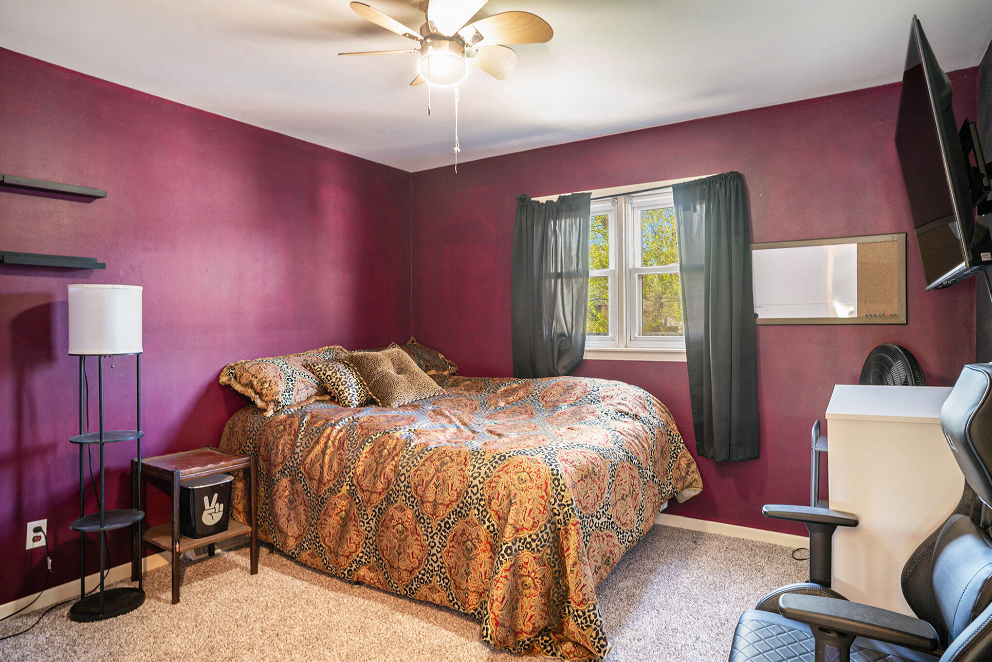 938 Walnut Lane Crown Point, IN 46307 - Photo 10 of 17 a bedroom with a bed and a chandelier