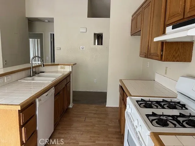 a kitchen with a stove and a sink