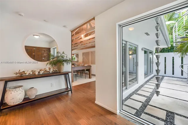 a view of a living room and a wooden floor